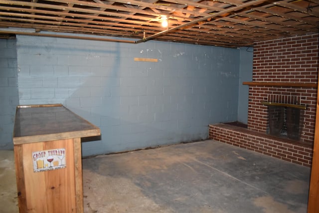 25 Ariel St, Lincoln, ME 04457 - below grade area featuring a fireplace and concrete block wall
