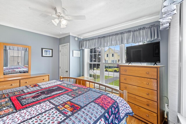 25 Harding St, Biddeford, ME 04005 - bedroom featuring ornamental molding, ceiling fan, and wood finished floors