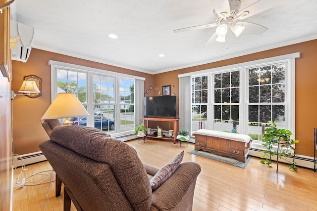 25 Harding St, Biddeford, ME 04005 - living room featuring a baseboard heating unit, crown molding, a ceiling fan, recessed lighting, and wood finished floors