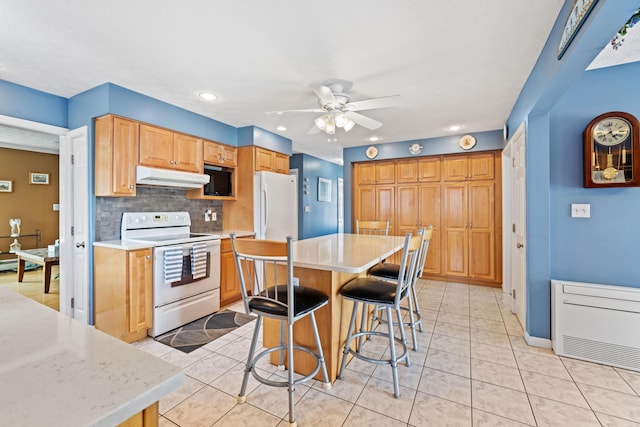 25 Harding St, Biddeford, ME 04005 - kitchen featuring white appliances, under cabinet range hood, a ceiling fan, light countertops, and recessed lighting