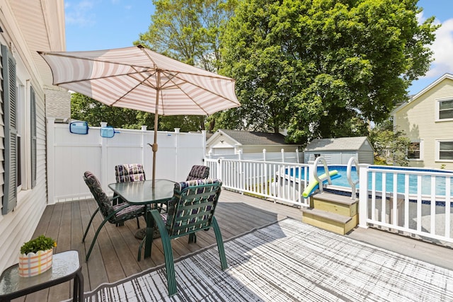 25 Harding St, Biddeford, ME 04005 - wooden terrace with outdoor dining space and an outdoor structure