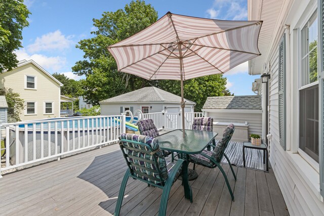 25 Harding St, Biddeford, ME 04005 - wooden terrace featuring outdoor dining area and an outdoor structure