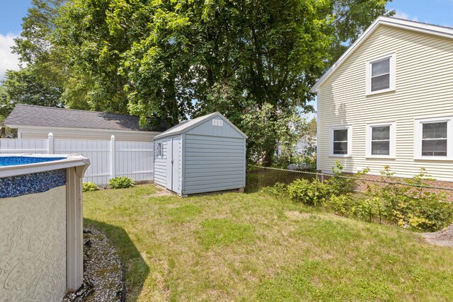 25 Harding St, Biddeford, ME 04005 - fenced backyard with a storage unit
