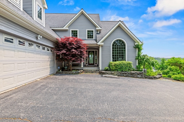 33 Lakeview Ln, Harrison, ME 04040 - traditional-style house with a shingled roof, asphalt driveway, and an attached garage