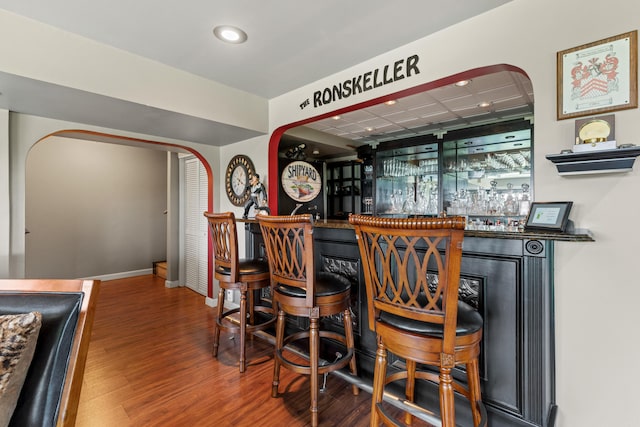 33 Lakeview Ln, Harrison, ME 04040 - indoor dry bar with arched walkways, wood finished floors, a paneled ceiling, and recessed lighting