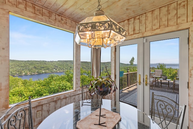 33 Lakeview Ln, Harrison, ME 04040 - sunroom featuring a chandelier, a water view, and plenty of natural light