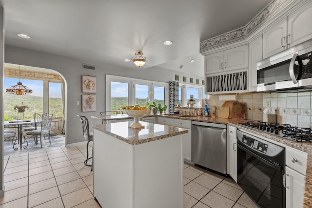 33 Lakeview Ln, Harrison, ME 04040 - kitchen featuring appliances with stainless steel finishes, a peninsula, light tile patterned floors, white cabinetry, and recessed lighting