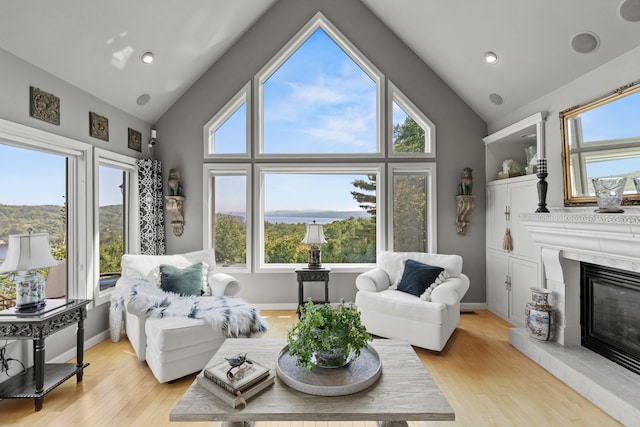 33 Lakeview Ln, Harrison, ME 04040 - living area with plenty of natural light, light wood-style flooring, a premium fireplace, recessed lighting, and high vaulted ceiling