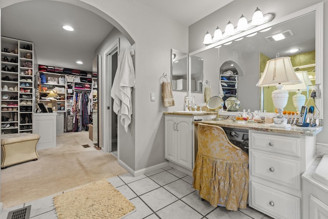 33 Lakeview Ln, Harrison, ME 04040 - full bath featuring vanity, a spacious closet, and tile patterned flooring