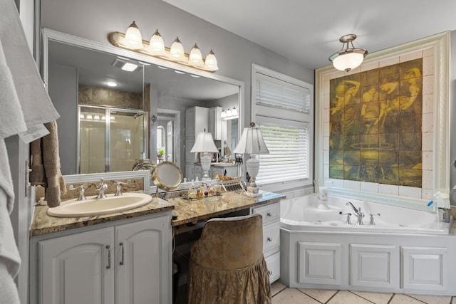 33 Lakeview Ln, Harrison, ME 04040 - full bath featuring a shower stall, vanity, a whirlpool tub, and tile patterned flooring