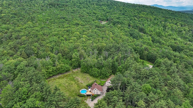370 Center Conway Rd, Brownfield, ME 04010 - drone / aerial view of a heavily wooded area and a mountain backdrop