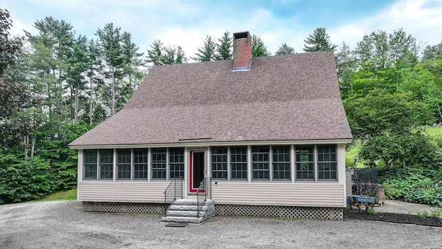 370 Center Conway Rd, Brownfield, ME 04010 - view of front of home with roof with shingles, entry steps, a chimney, and a sunroom