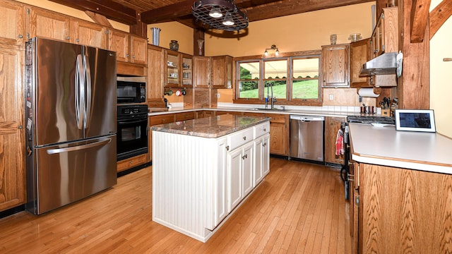 370 Center Conway Rd, Brownfield, ME 04010 - kitchen featuring black appliances, light wood-style floors, brown cabinetry, and a wooden ceiling with exposed beams