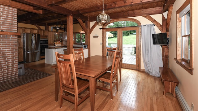 370 Center Conway Rd, Brownfield, ME 04010 - dining space with a baseboard radiator, light wood finished floors, a wood ceiling with exposed beams, and a chandelier