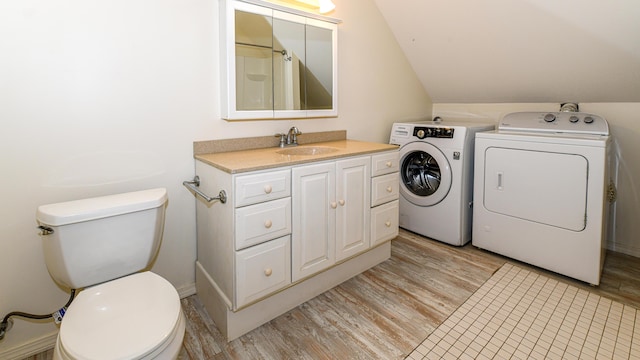 370 Center Conway Rd, Brownfield, ME 04010 - laundry room with separate washer and dryer and light wood finished floors