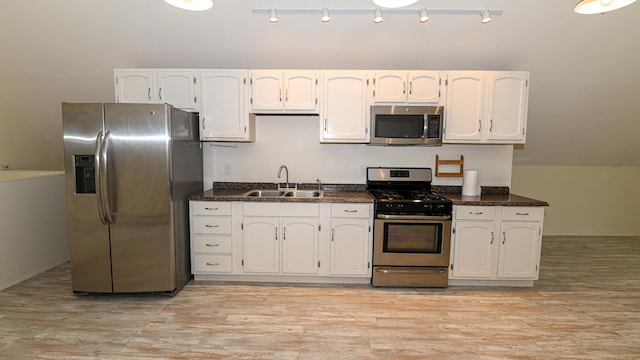 370 Center Conway Rd, Brownfield, ME 04010 - kitchen featuring stainless steel appliances, white cabinets, and light wood-type flooring