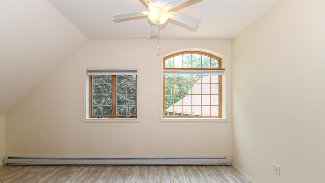 370 Center Conway Rd, Brownfield, ME 04010 - additional living space featuring plenty of natural light, wood finished floors, a ceiling fan, baseboard heating, and lofted ceiling