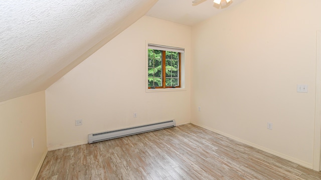370 Center Conway Rd, Brownfield, ME 04010 - bonus room with baseboard heating, light wood-type flooring, lofted ceiling, a textured ceiling, and a ceiling fan