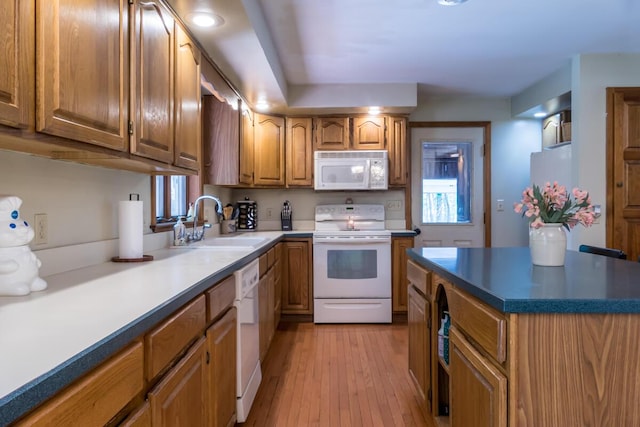9 Kennebec Cir, Bath, ME 04530 - kitchen featuring white appliances, brown cabinets, and light wood-style floors