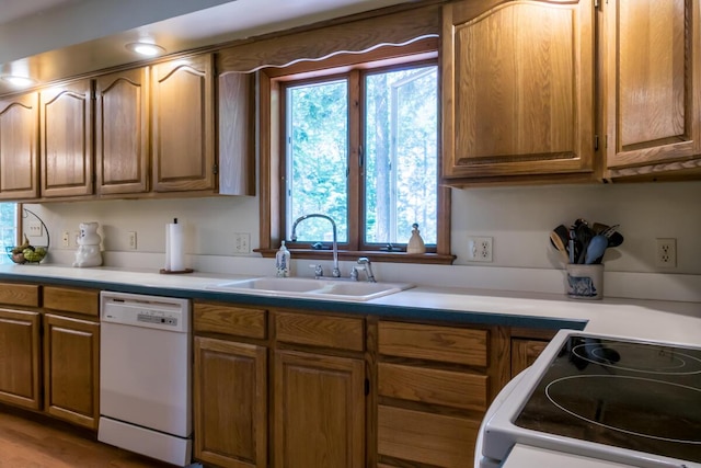 9 Kennebec Cir, Bath, ME 04530 - kitchen with dishwasher, stove, light countertops, and brown cabinetry