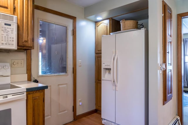 9 Kennebec Cir, Bath, ME 04530 - kitchen featuring white appliances, brown cabinetry, light countertops, and light wood-type flooring