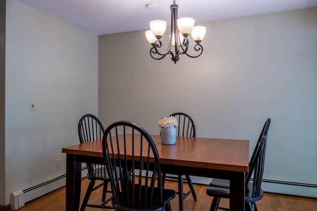 9 Kennebec Cir, Bath, ME 04530 - dining area with a chandelier, a baseboard radiator, and wood finished floors