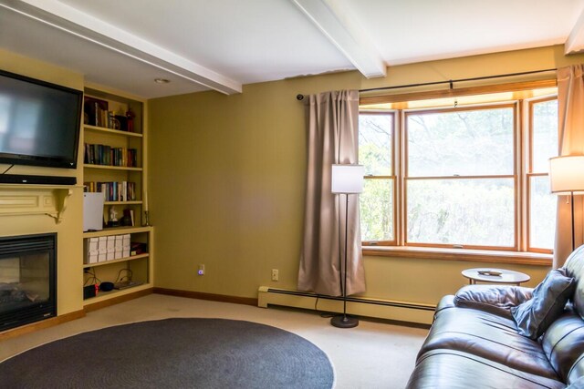 9 Kennebec Cir, Bath, ME 04530 - carpeted living room with a baseboard heating unit, beamed ceiling, and a glass covered fireplace