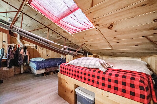 41 Dundee Rd, Albany Twp, ME 04217 - bedroom with wood finished floors, wooden walls, wooden ceiling, and vaulted ceiling