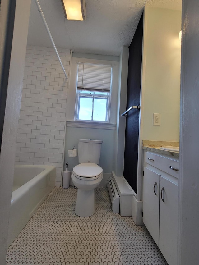 59 Washington St, Biddeford, ME 04005 - full bath featuring vanity, tile patterned floors, baseboard heating, and bathing tub / shower combination