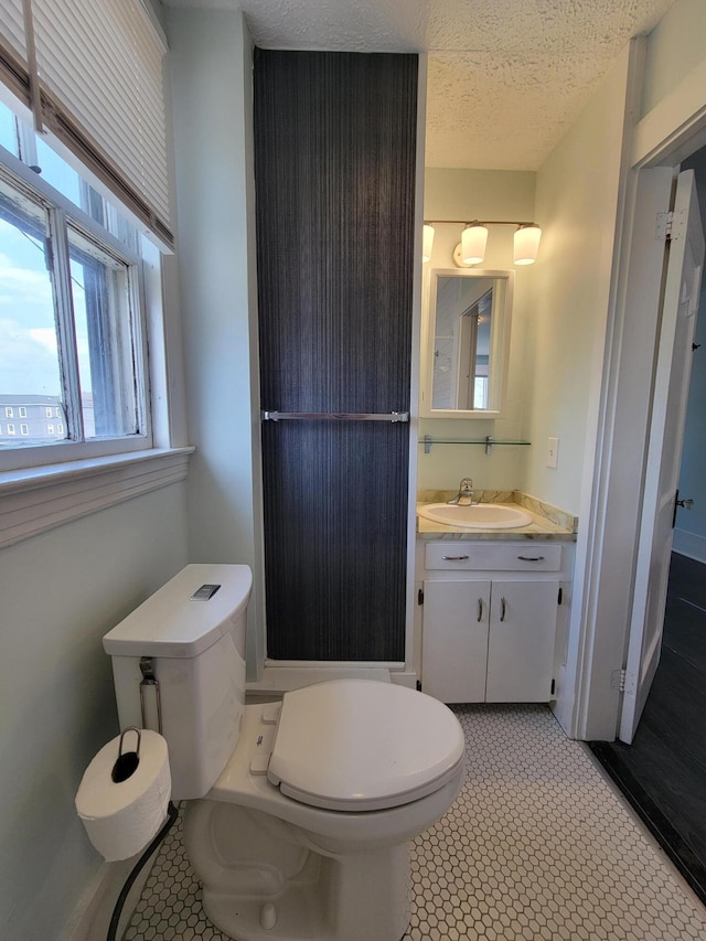 59 Washington St, Biddeford, ME 04005 - bathroom with vanity and a textured ceiling