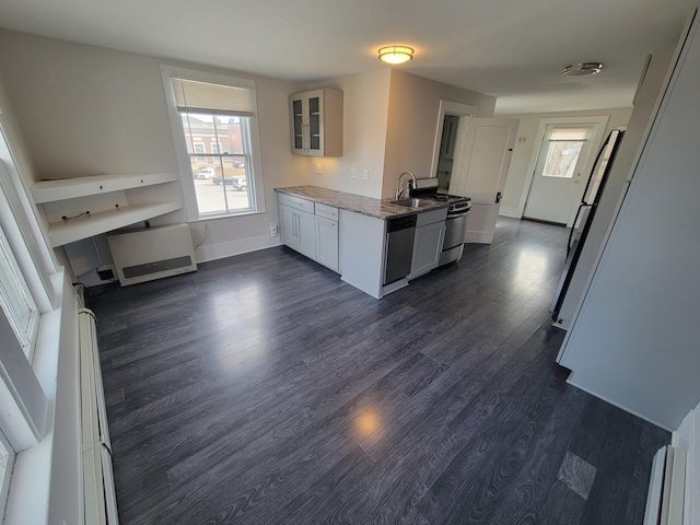 59 Washington St, Biddeford, ME 04005 - kitchen with dark wood finished floors, freestanding refrigerator, glass insert cabinets, and stainless steel gas range