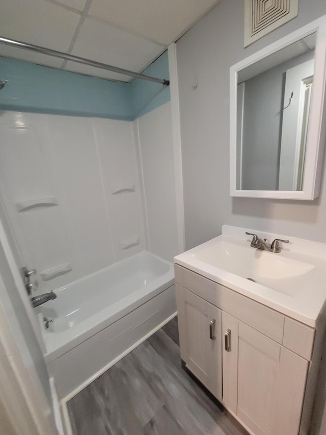 59 Washington St, Biddeford, ME 04005 - full bathroom with vanity, washtub / shower combination, and wood finished floors