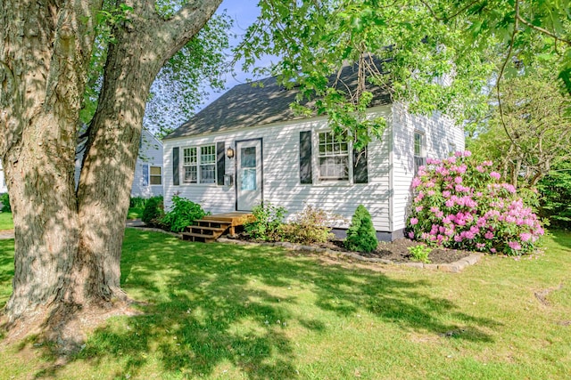 52 Mckinley St, South Portland, ME 04106 - view of front of house featuring a front lawn and roof with shingles