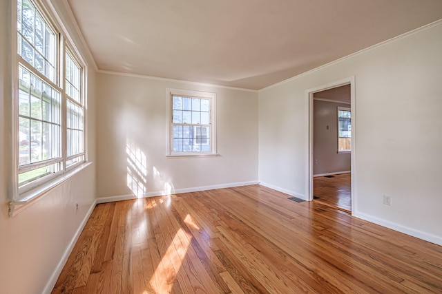 52 Mckinley St, South Portland, ME 04106 - empty room with wood-type flooring and ornamental molding