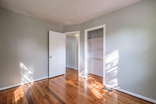 52 Mckinley St, South Portland, ME 04106 - unfurnished bedroom with wood finished floors and a closet