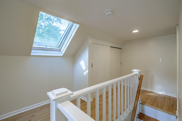 52 Mckinley St, South Portland, ME 04106 - corridor featuring an upstairs landing, a skylight, light wood finished floors, recessed lighting, and lofted ceiling