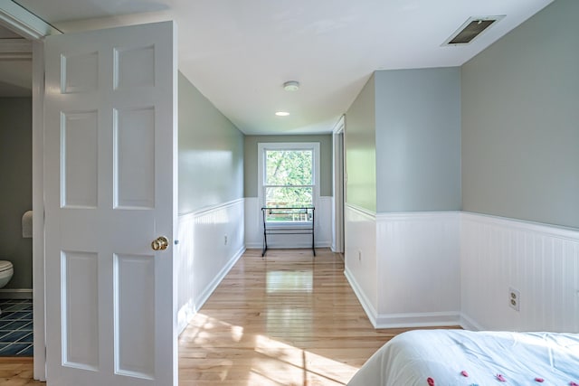 52 Mckinley St, South Portland, ME 04106 - bedroom featuring wainscoting and light wood finished floors