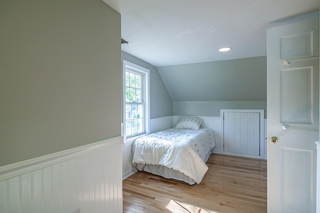 52 Mckinley St, South Portland, ME 04106 - bedroom with a wainscoted wall, lofted ceiling, and light wood finished floors