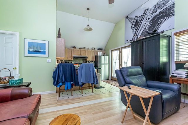 37 Paul St, York, ME 03909 - living area with light wood-type flooring, high vaulted ceiling, and ceiling fan