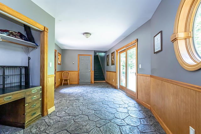 37 Paul St, York, ME 03909 - carpeted entryway featuring a wainscoted wall, stairs, and wooden walls