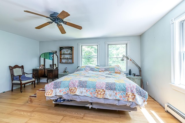 37 Paul St, York, ME 03909 - bedroom with baseboard heating, light wood-type flooring, and a ceiling fan