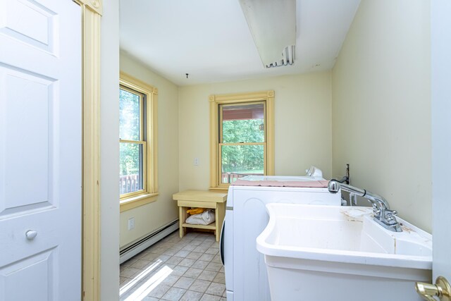 37 Paul St, York, ME 03909 - laundry room with baseboard heating, plenty of natural light, washer and dryer, and light tile patterned floors