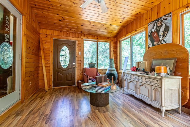 37 Paul St, York, ME 03909 - foyer entrance with vaulted ceiling, wooden walls, plenty of natural light, ceiling fan, and light wood-style floors