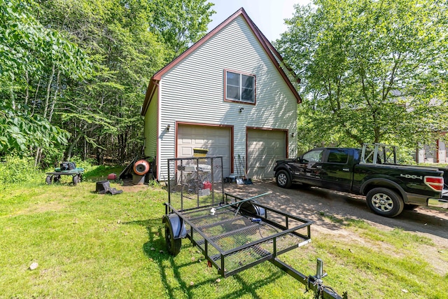 37 Paul St, York, ME 03909 - view of property exterior featuring a detached garage and a yard