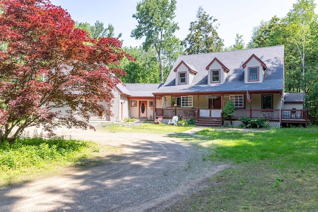 37 Paul St, York, ME 03909 - cape cod house featuring dirt driveway, a porch, a front yard, and a shingled roof