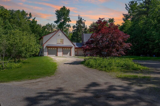 37 Paul St, York, ME 03909 - view of front of house featuring dirt driveway and a garage