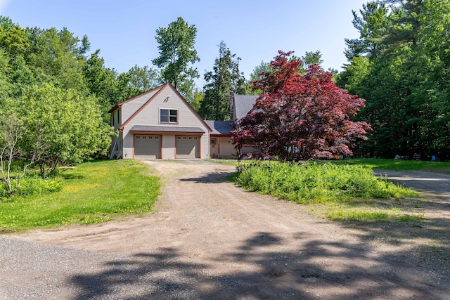 37 Paul St, York, ME 03909 - view of front of house featuring driveway and a garage
