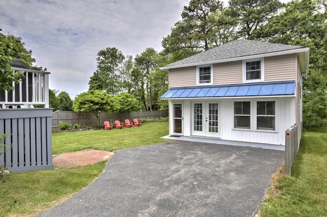23 E Grand Ave, Scarborough, ME 04074 - view of patio / terrace featuring french doors and driveway
