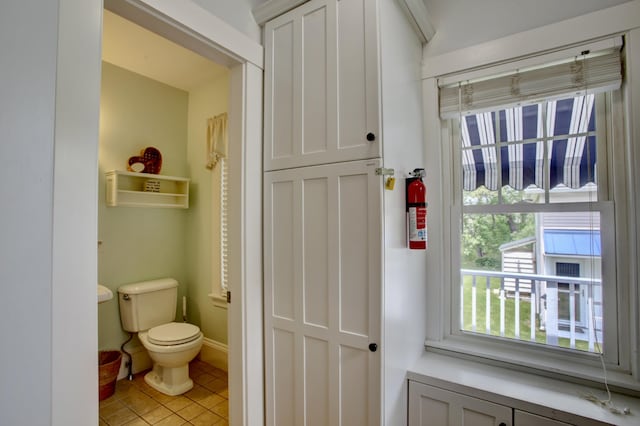 23 E Grand Ave, Scarborough, ME 04074 - bathroom featuring toilet and tile patterned flooring