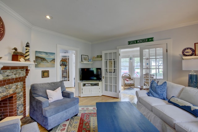 23 E Grand Ave, Scarborough, ME 04074 - living area with ornamental molding, french doors, a fireplace, light wood-type flooring, and recessed lighting